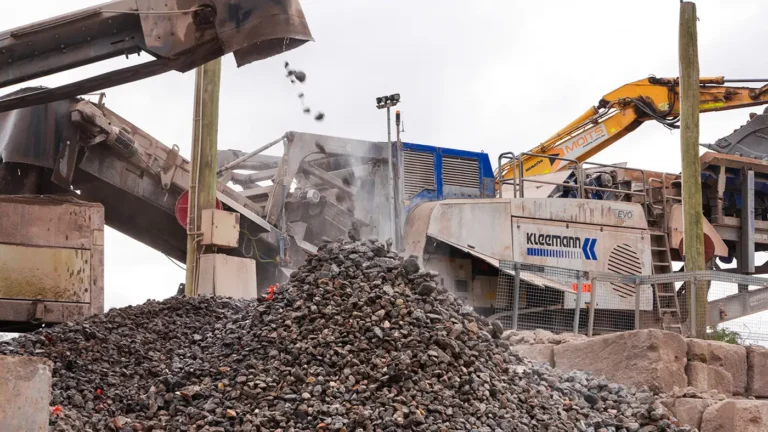 About - crushed rocks converyor into mound - 1400