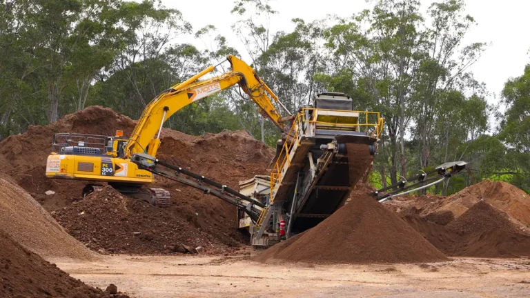 About - excavator and crusher - earth material 1400px